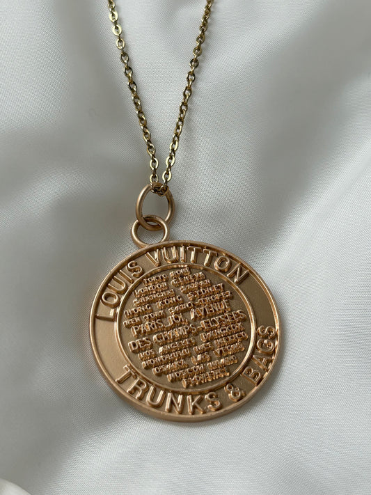 Louis Vuitton trunks and bags medallion