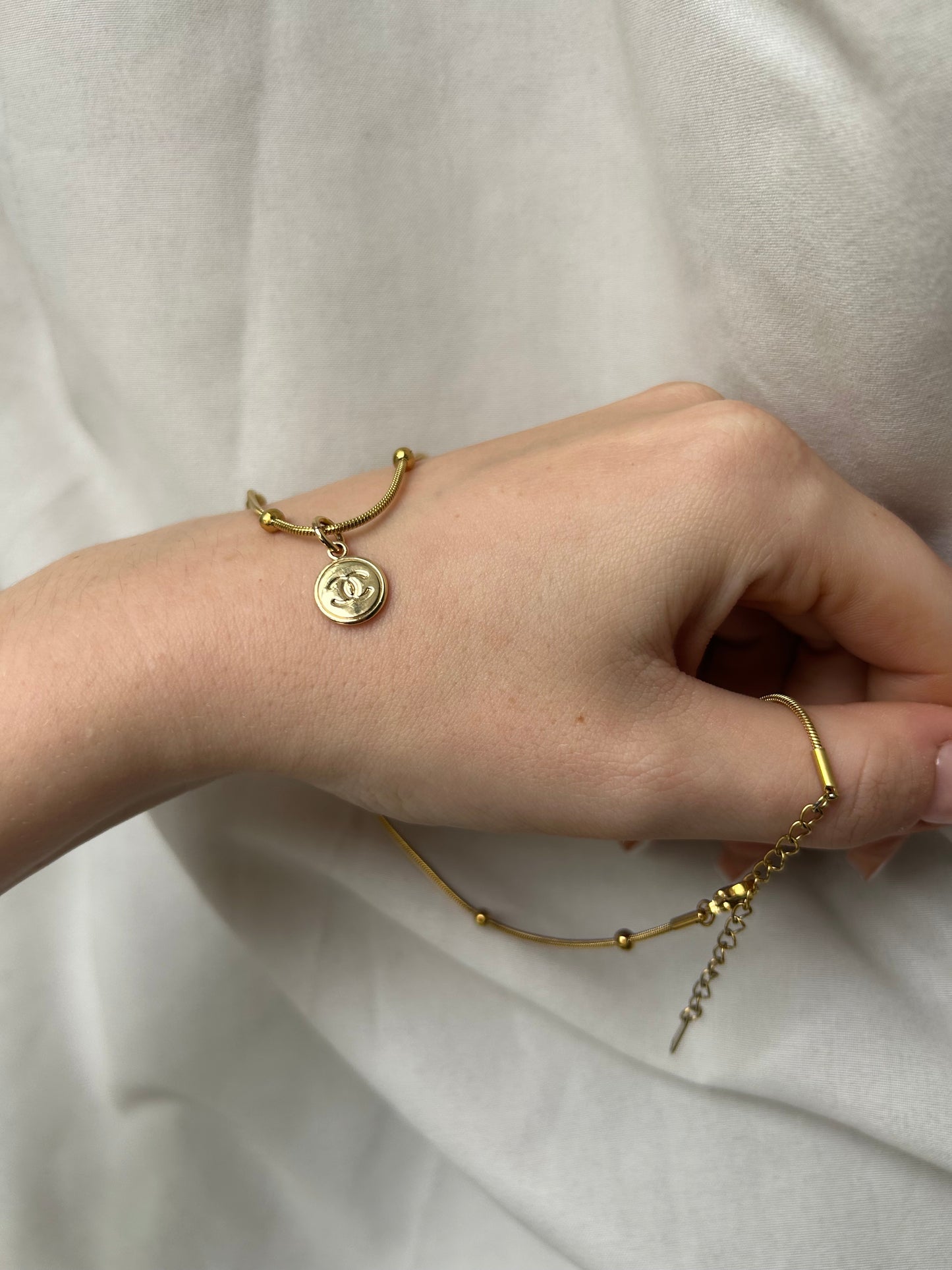 Lil’ Chanel on baller chain gold plate